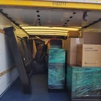 Loading and unloading movers in Salt Lake City by Heavy Lift Moving Co handling furniture and boxes safely