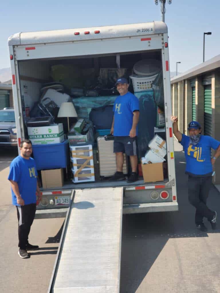 Professional movers loading furniture into a moving truck in Utah