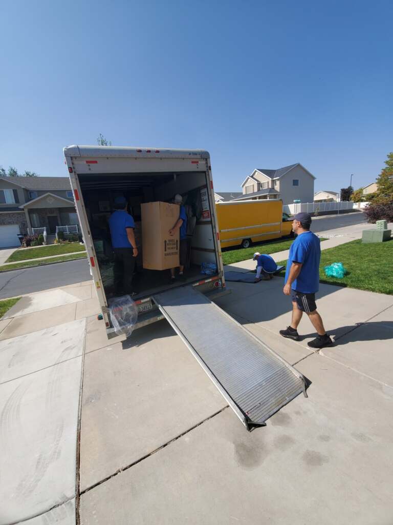 Heavy Lift Moving Co truck parked at customer driveway in Utah
