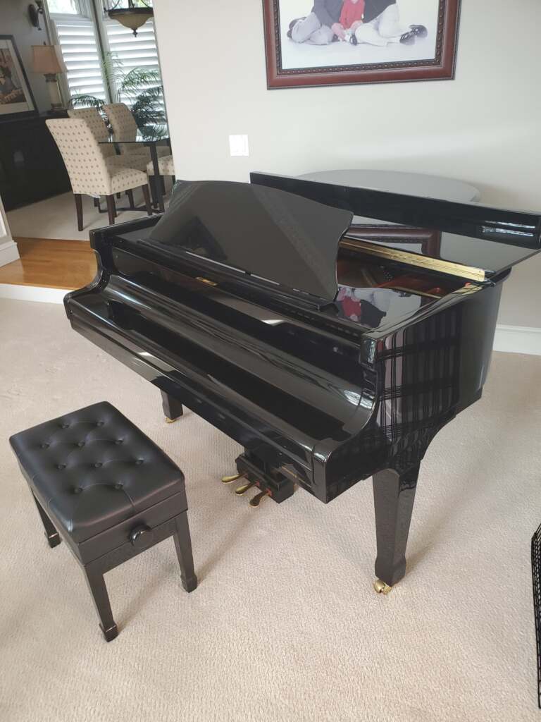 Piano being moved carefully inside a home in Utah