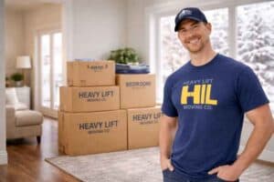 Apartment movers in Salt Lake City by Heavy Lift Moving Co handling boxes inside an apartment